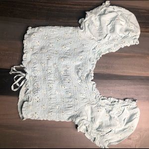 Light blue, off the shoulders crop top.